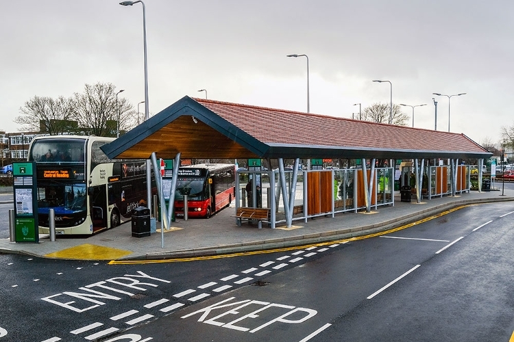 A photograph of two buses parked at Newbury Wharf Bus Station