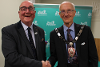 Last year’s Chairman, Councillor Billy Drummond, congratulating Councillor Vickers on his election.