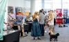 Indoor stands, visitors, and a cute dog!